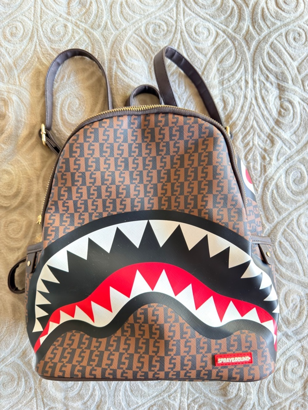 Sprayground Brown Logo Shark Bite Mini Backpack with Red Accent
